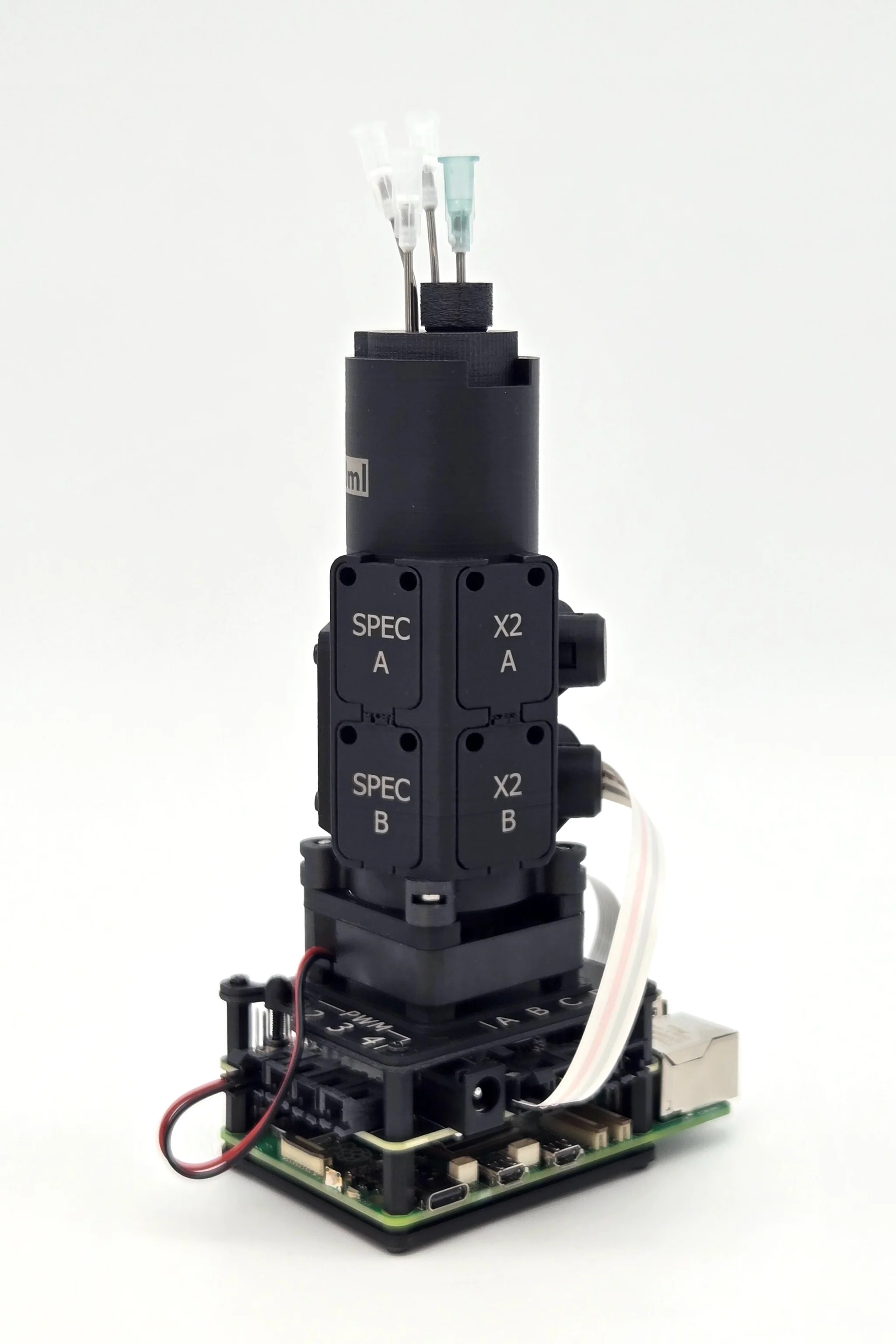 Pioreactor 40 mL with a black printed housing, marked lettering and assembled electronics.